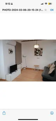 a living room with a couch and a table at Apartamento centro histórico in Valencia