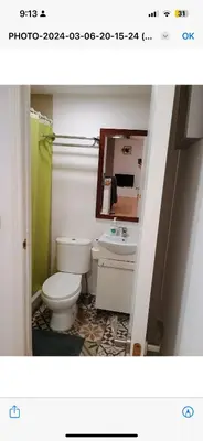 a bathroom with a toilet and a sink and a mirror at Apartamento centro histórico in Valencia