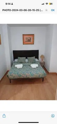 a bedroom with a bed with two towels on it at Apartamento centro histórico in Valencia