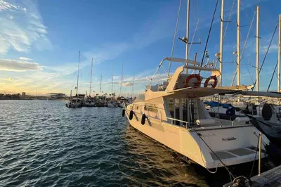 a group of boats docked in a harbor at Barco Apartamento Playa Valencia in Valencia