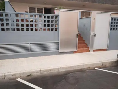 a house with a gate and stairs in front of it at Apartamento en la playa in Moncófar