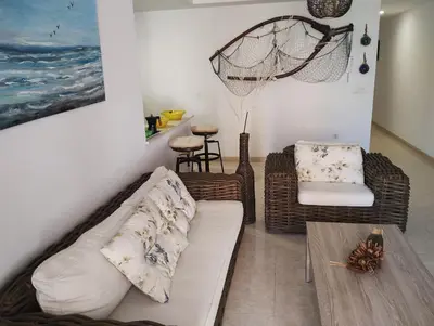 a living room with a couch and a table at Apartamento en la playa in Moncófar