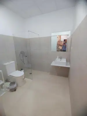 a bathroom with a toilet and a sink and a shower at Valencia Beach PINK in Valencia