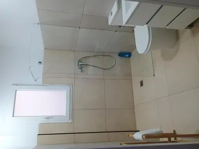 a shower with a window in a bathroom at Valencia Beach PINK in Valencia