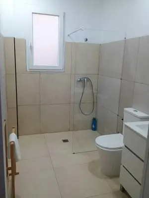 a bathroom with a shower and a toilet at Valencia Beach PINK in Valencia
