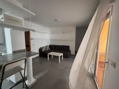 a living room with a couch and a table at Apto 3 habitaciones, vistas al mar Moncofar Grao in Moncófar