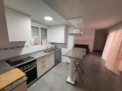 a kitchen with a sink and a counter top at Apto 3 habitaciones, vistas al mar Moncofar Grao in Moncófar