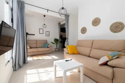 a living room with a couch and a table at Apartamento Ruzafa 1 habitacion y 2 sofas cama in Valencia