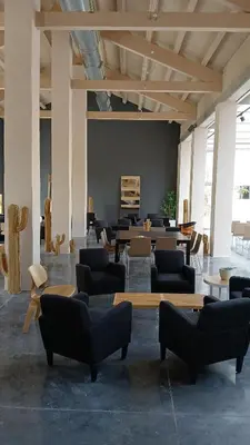 a living room with couches and tables in a room at Apartamento en molino con piscina in Paterna
