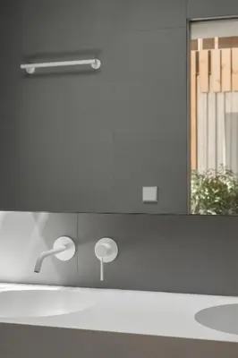 a bathroom counter with a sink and a mirror at Apartamentos Maestro Sosa in Valencia