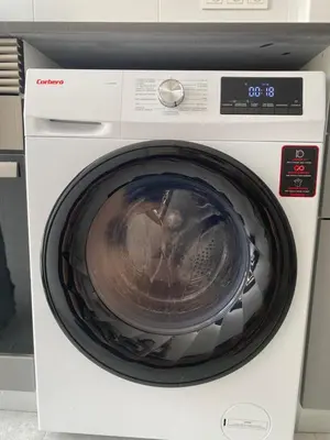 a white washing machine with its door open at Adosado en Playa Casablanca in Almenara