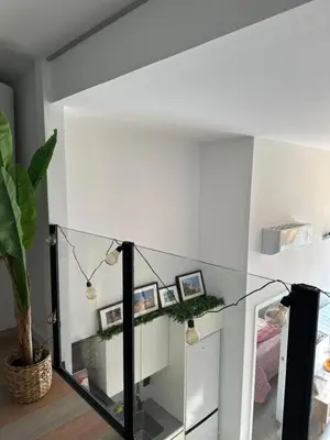 a room with a glass table with pictures on the wall at Loft Camp del Turia A5 - Housevanlive in Valencia