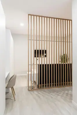 a gate in a room with a table and a chair at Favara Suites A by Concept Flats in Valencia