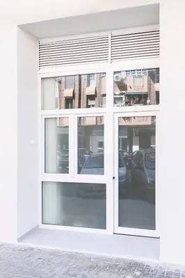 a white window in a building with cars in it at Favara Suites A by Concept Flats in Valencia