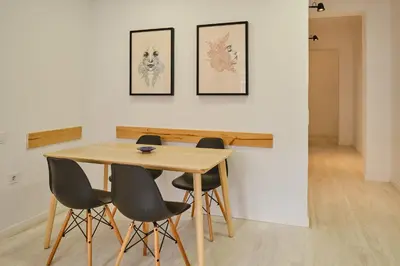a dining room table and chairs in a room at PATRAIX FLAT in Valencia