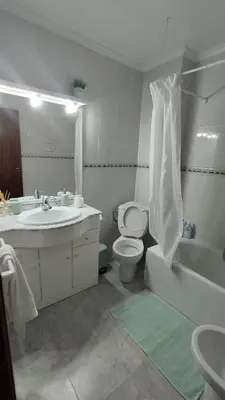 a bathroom with a sink and a toilet and a tub at Sea view apartment, first line on the beach, Remote work in Canet de Berenguer