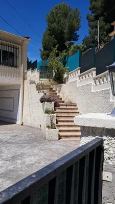 a set of stairs leading up to a house at Naquera House & Pool in Náquera