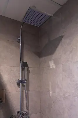 a shower with a shower head in a bathroom at Mediterraneo Stay in Valencia