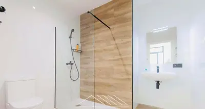 a bathroom with a shower and a toilet and a sink at Valencia Veneta Calda in Valencia