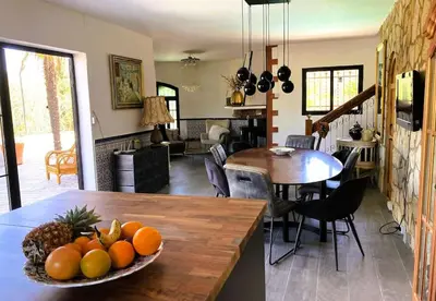 a bowl of fruit on a table in a kitchen at Villa Torre, Valencia Spanje in Macastre