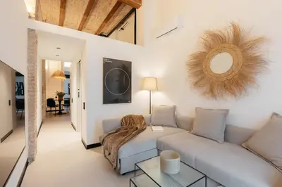 a living room with a couch and a table at Lovely Exclusivity in Valencia Center in Valencia