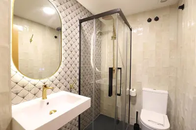 a bathroom with a sink and a shower and a toilet at Maravilloso adosado para 8 en entorno privilegiado by Hometels in Canet de Berenguer