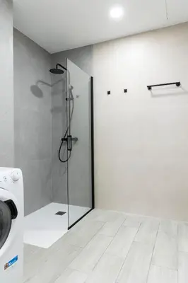 a shower with a glass door in a bathroom at Favara Suites B by Concept Flats in Valencia