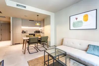 a living room with a couch and a table at Apartamentos 87 Llaves in Valencia