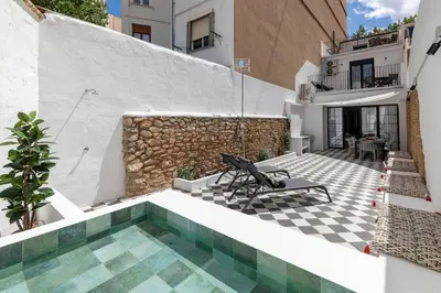 a house with a swimming pool next to a building at My Loft 4 You Patraix Style in Valencia