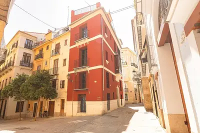 a red building on the side of a street at GuestReady - A perfect stay in Ciutat Vella in Valencia