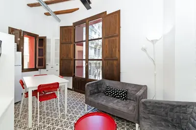 a living room with a couch and a table at GuestReady - A perfect stay in Ciutat Vella in Valencia