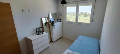 a small white room with a window and a dresser at Beach,s House in Playa del Puig in La Torre