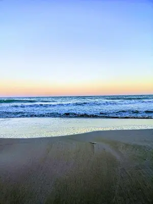 an empty beach with the ocean in the background at Beach,s House in Playa del Puig in La Torre