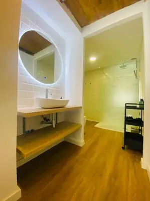a bathroom with a sink and a mirror at Beach Flat for Family & Groups in Valencia