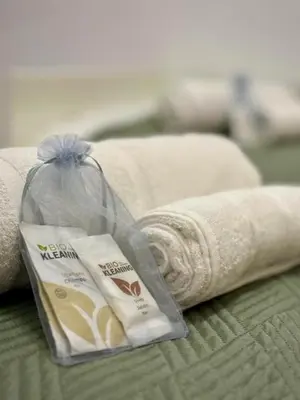 a bag of toilet paper and towels on a bed at Aire in Valencia