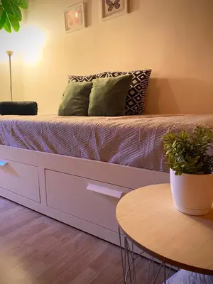 a bed in a room with a table at Aire in Valencia