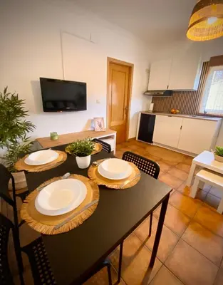 a dining room with a table with plates on it at Tierra in Valencia