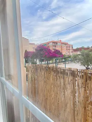 a window with a wooden fence in front of a building at Tierra in Valencia
