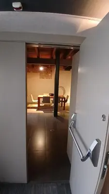 a door to a room with a table and a dining room at Loft en molino rehabilitado in Paterna