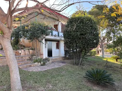 a small white house with a door and a driveway at Mediterranean House in Valencia in Valencia
