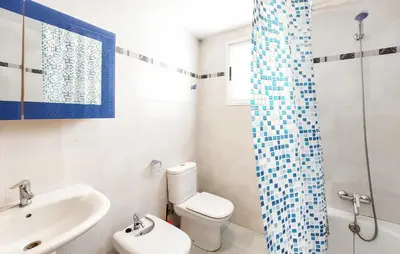 a bathroom with a toilet sink and a shower at 2 Bedroom Amazing Apartment In Moncofa in Moncófar