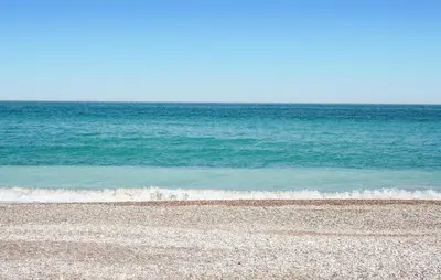 an empty beach with the ocean in the background at 2 Bedroom Amazing Apartment In Moncofa in Moncófar