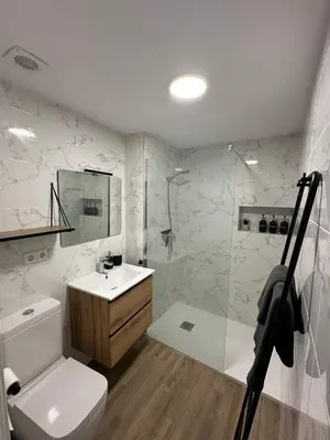 a bathroom with a toilet and a shower and a sink at El refugio del mar in Playa de Mar