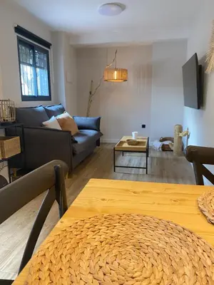 a living room with a couch and a table at El refugio del mar in Playa de Mar