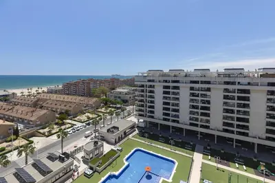 an aerial view of a large apartment building with a pool at ApartUP Patacona Sunrise Duplex II in Valencia
