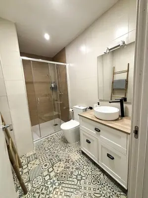 a bathroom with a toilet and a sink and a shower at Precioso apartamento en la playa in Valencia