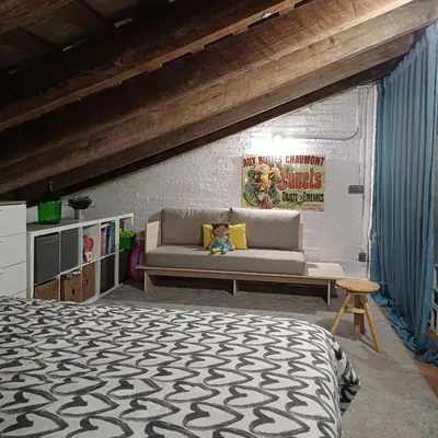 a bedroom with a bed and a couch at La Auténtica in Valencia