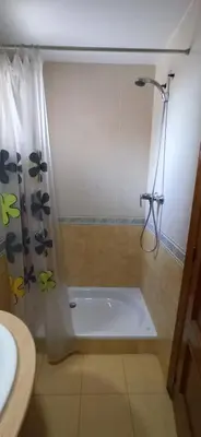 a bathroom with a shower and a bath tub at Casa Sol y montaña-habitaciones in Torrent
