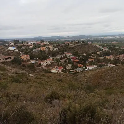 a view of a town from the top of a hill at Casa Sol y montaña-habitaciones in Torrent