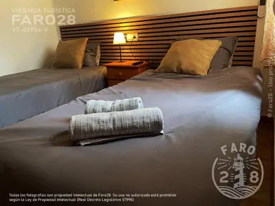 two beds sitting next to each other in a room at Faro28 in Valencia